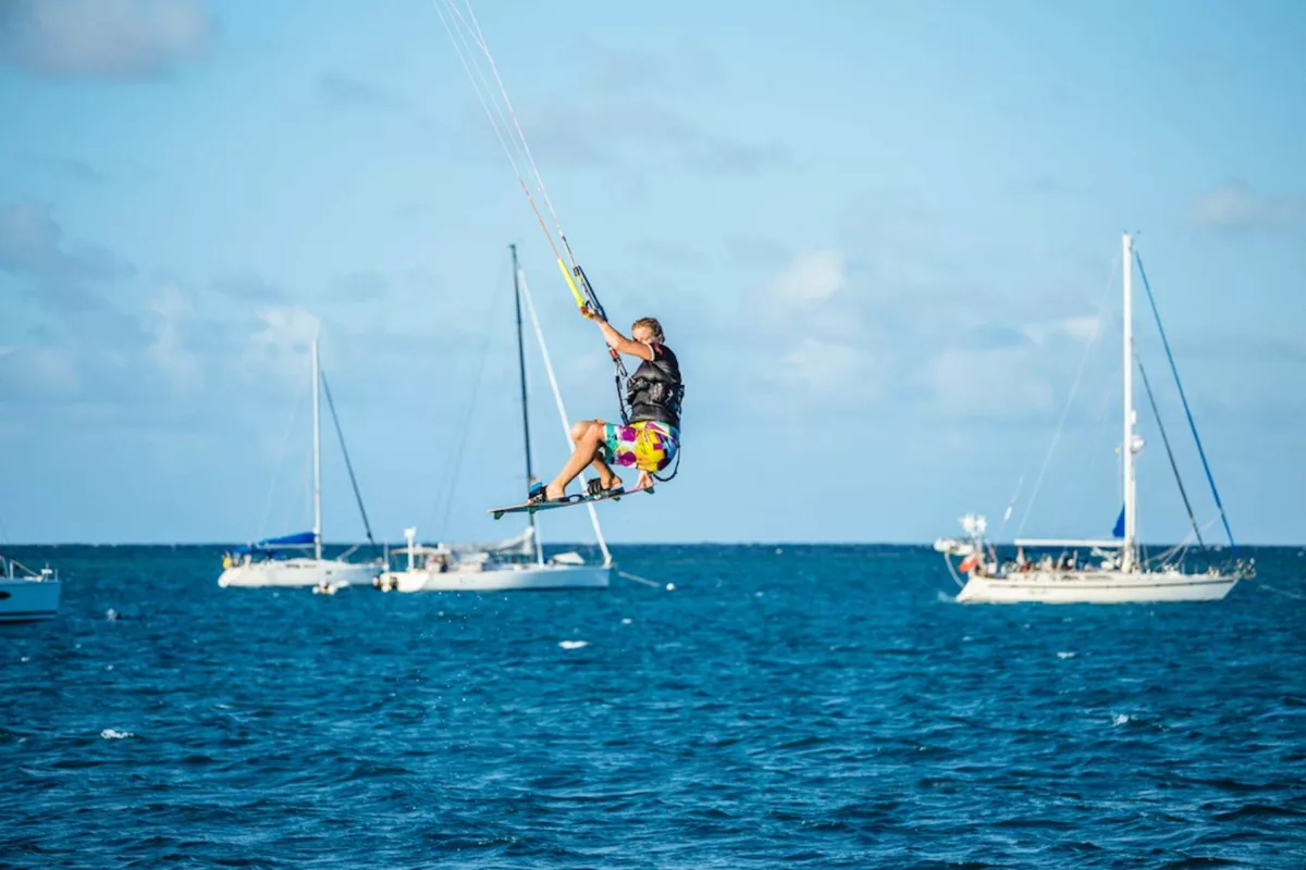 kitesurfing jump in front of boat