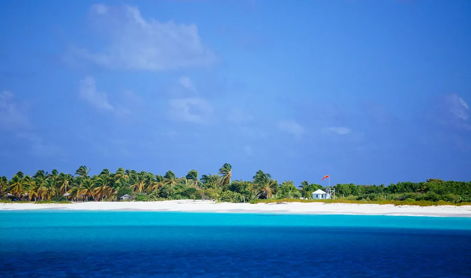 turquoise water and sandy white  beach in Antigua